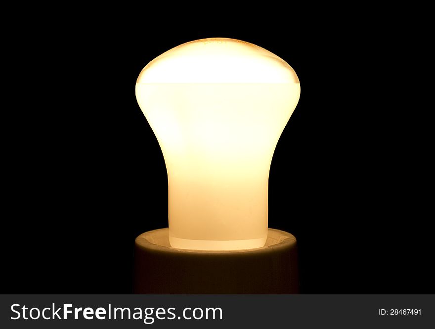A bright light bulb in black background.