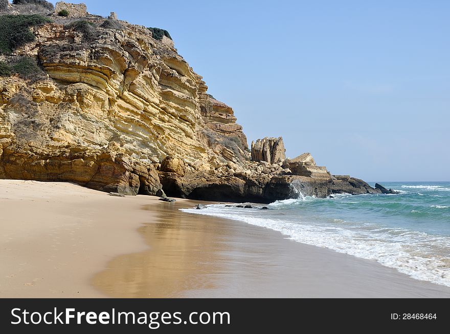 Praia de Figueira in Algarve, Portugal. One of the many beautiful beaches in the region. Praia de Figueira in Algarve, Portugal. One of the many beautiful beaches in the region.