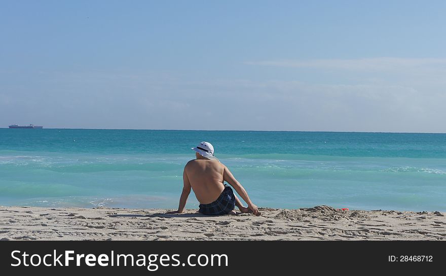 Man sitting on the beach