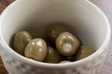 Green Olives In A White Bowl Stock Photo