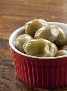 Green Olives In A Red And White Bowl Stock Photos