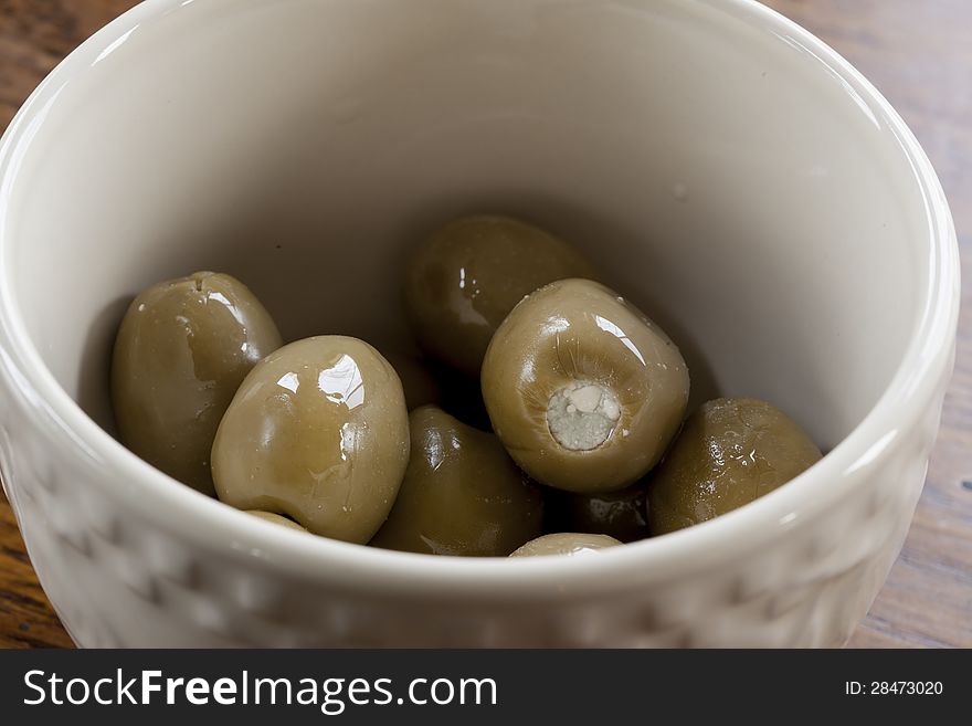 Green Olives In A White Bowl