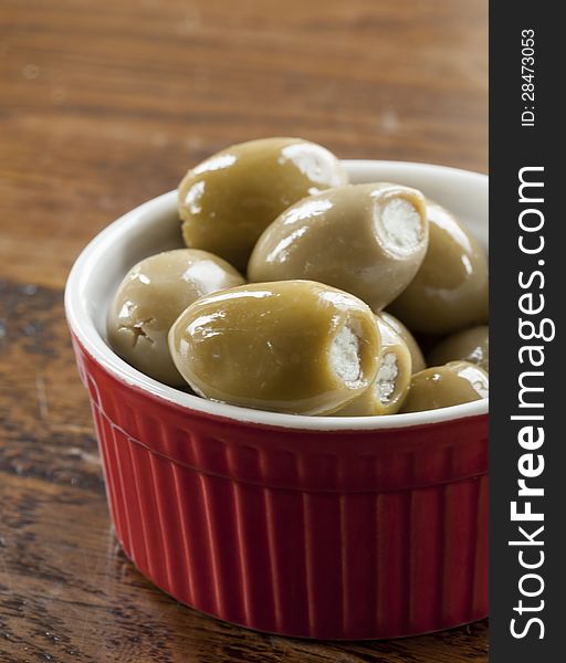 Green Olives in a Red and White Bowl