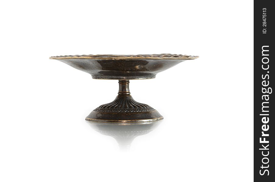 Nice ancient bronze fruit bowl on white background. Clipping path is included. Nice ancient bronze fruit bowl on white background. Clipping path is included