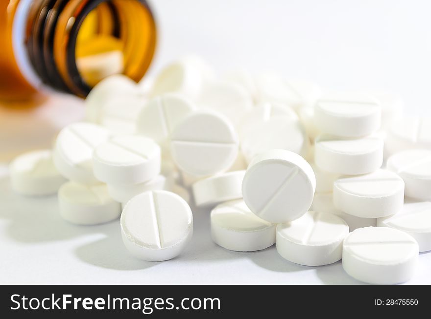 Pills Spilling out of Pill Bottle Shallow DOF