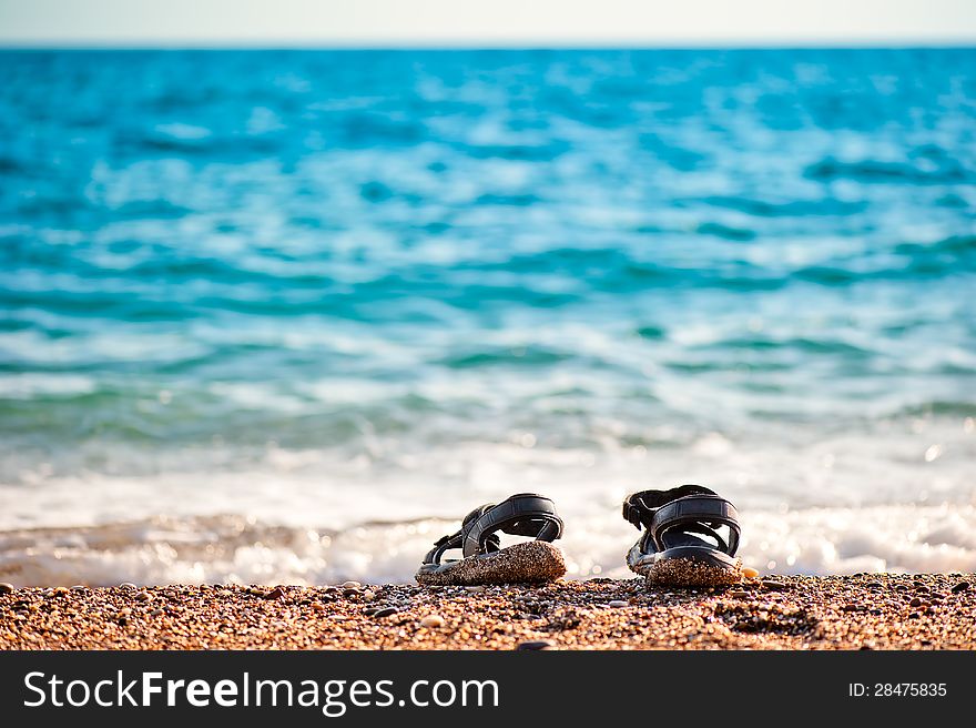 Beach Shoes At The Edge