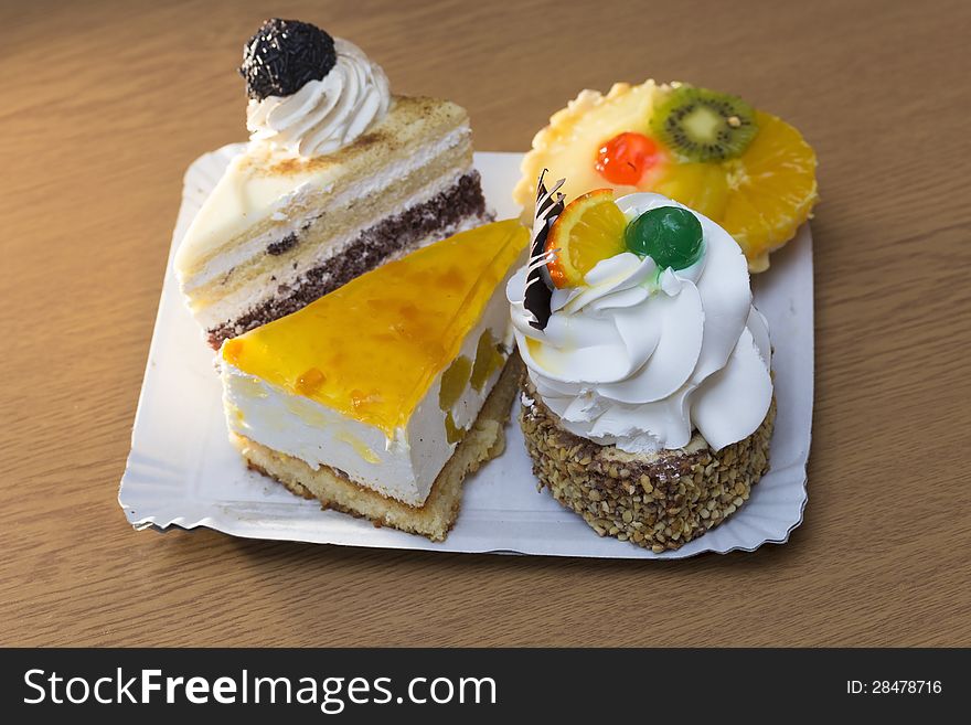 Four diferent cakes in a studio