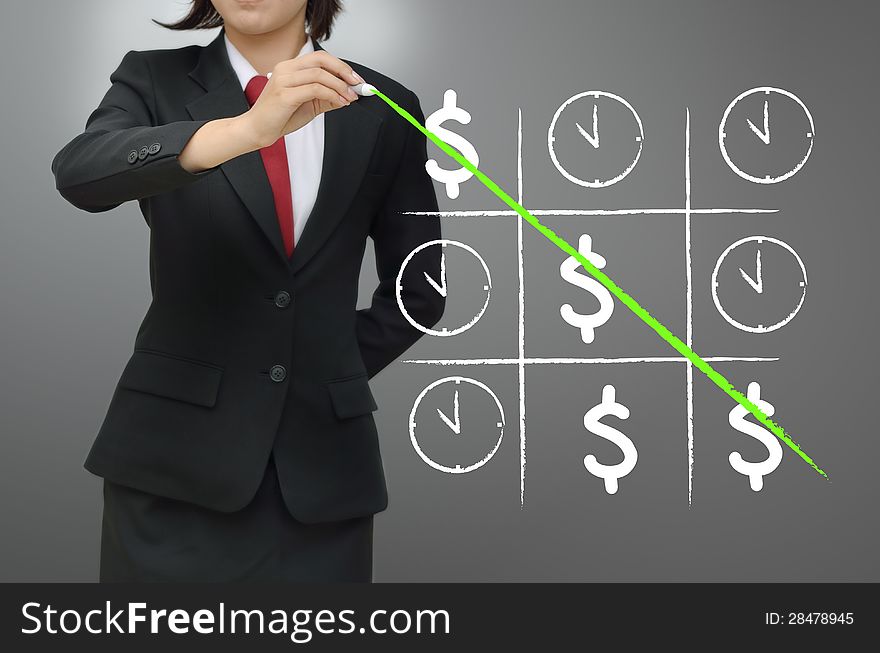 Business woman playing time and money game