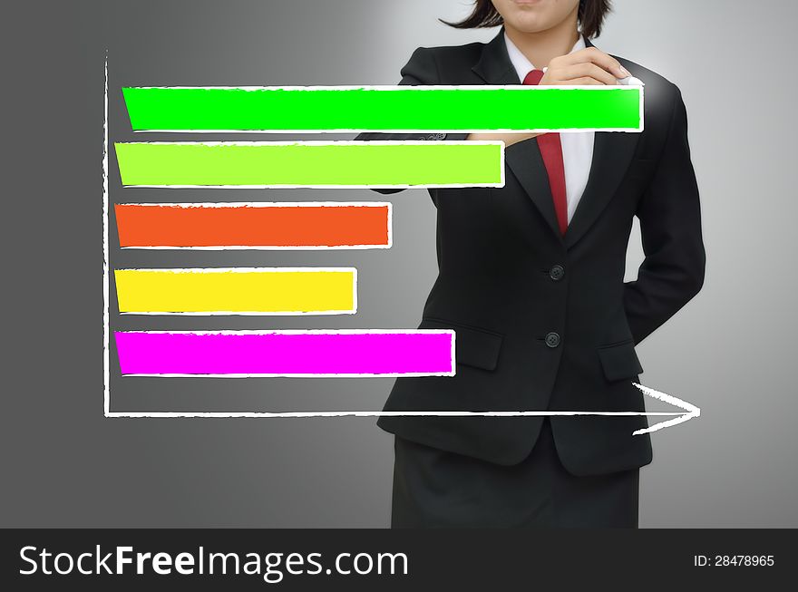 Business woman drawing growing graph