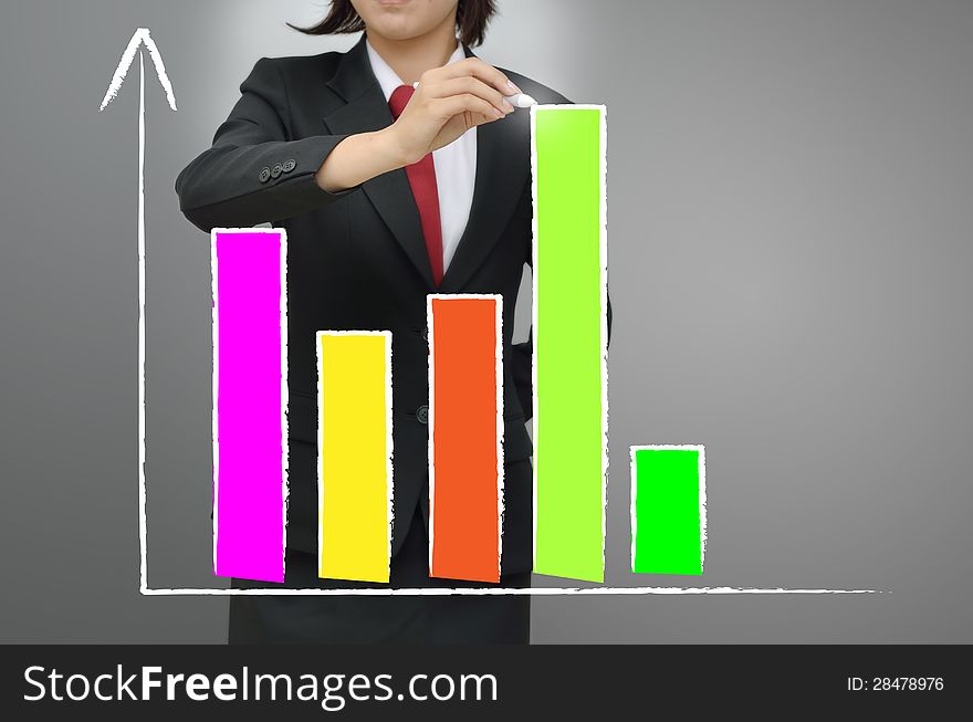 Business woman drawing growing graph