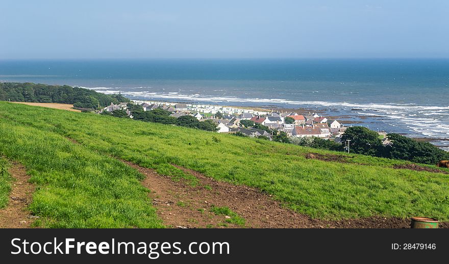 Scottish landscape with small village on the seashore (north east of Scotland)