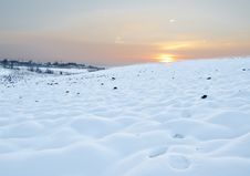 Snow Field At Sunset Stock Photo