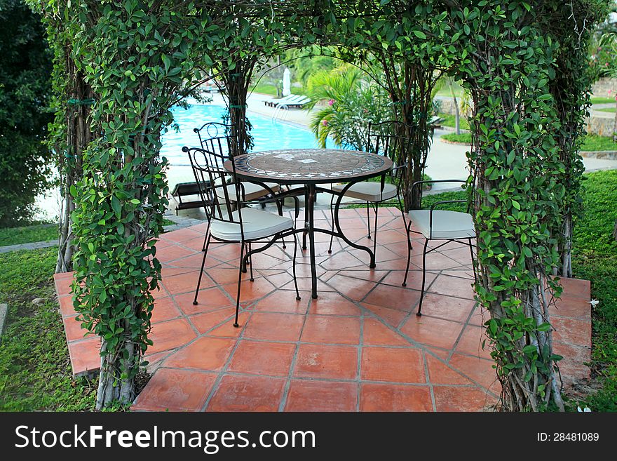 Beautiful green gazebo pavilion in the resort garden. Beautiful green gazebo pavilion in the resort garden