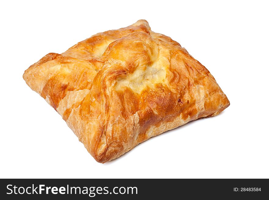 Pie from flaky pastry on a white background