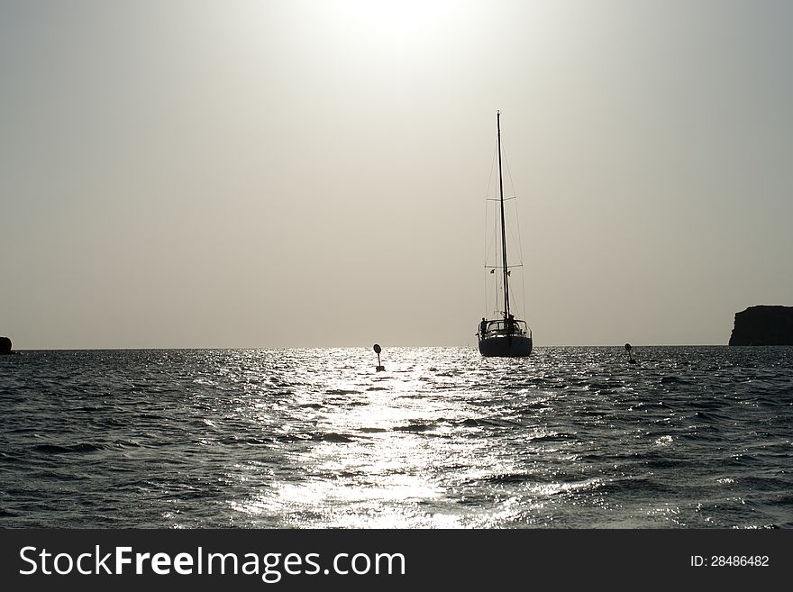 Sailboat On Sea In The Sunset