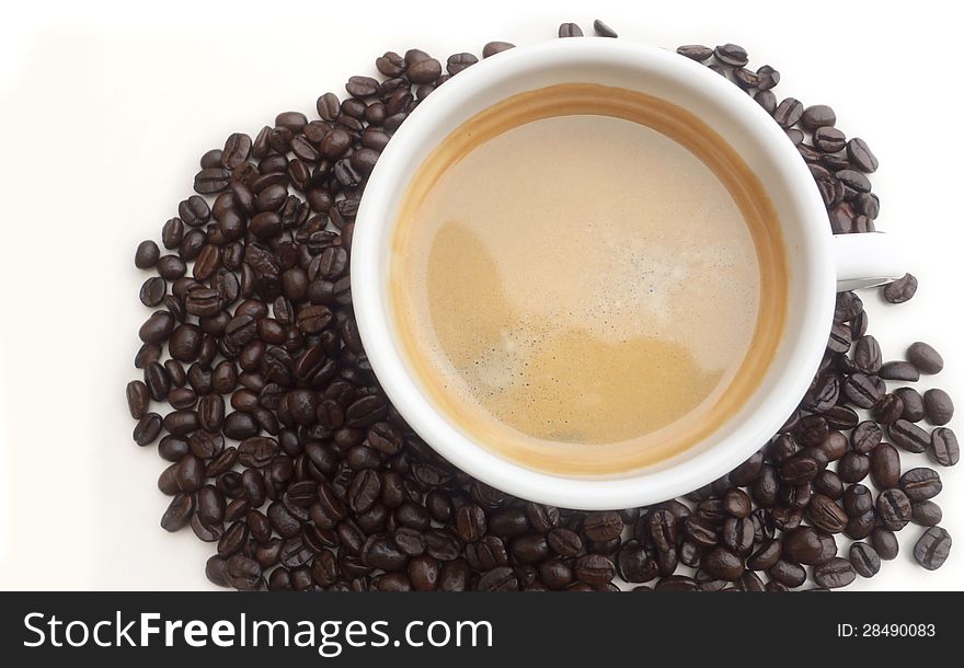 Coffee cup in an environment of Coffee beans. Coffee cup in an environment of Coffee beans