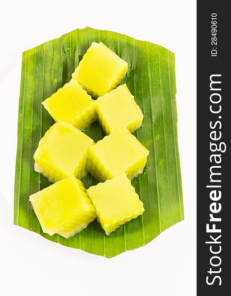 Thai dessert called Thai sweetmeat on banana leaf isolated on white background