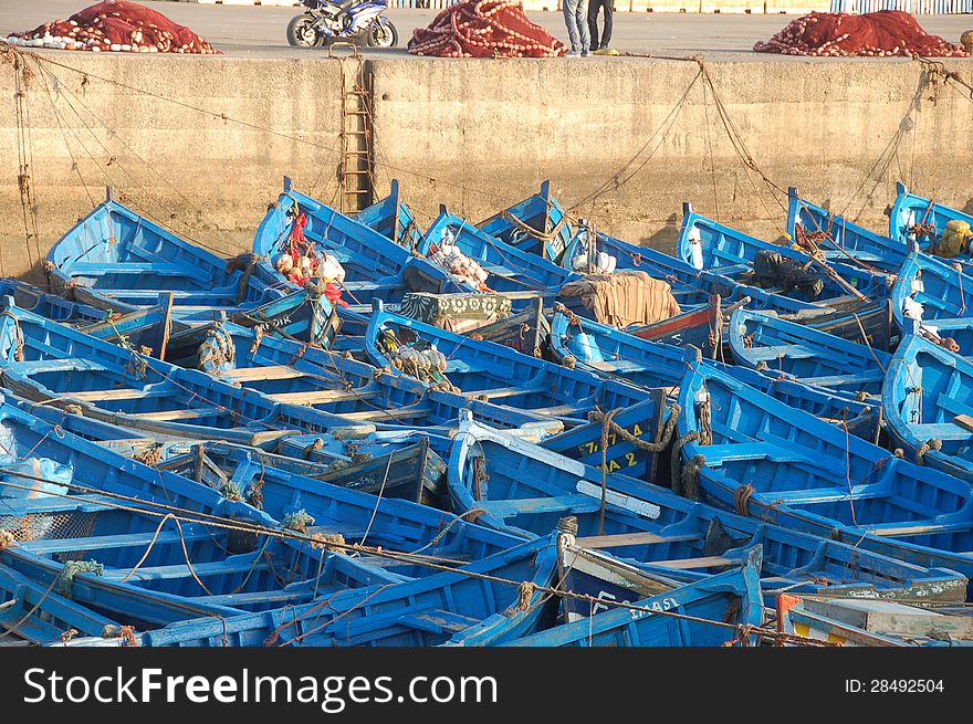 Blue fishing boats in port of Essaouria, Morocco