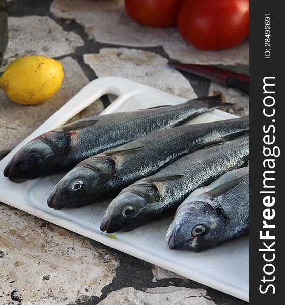 Prepared marine fish for barbecue on the open fire place