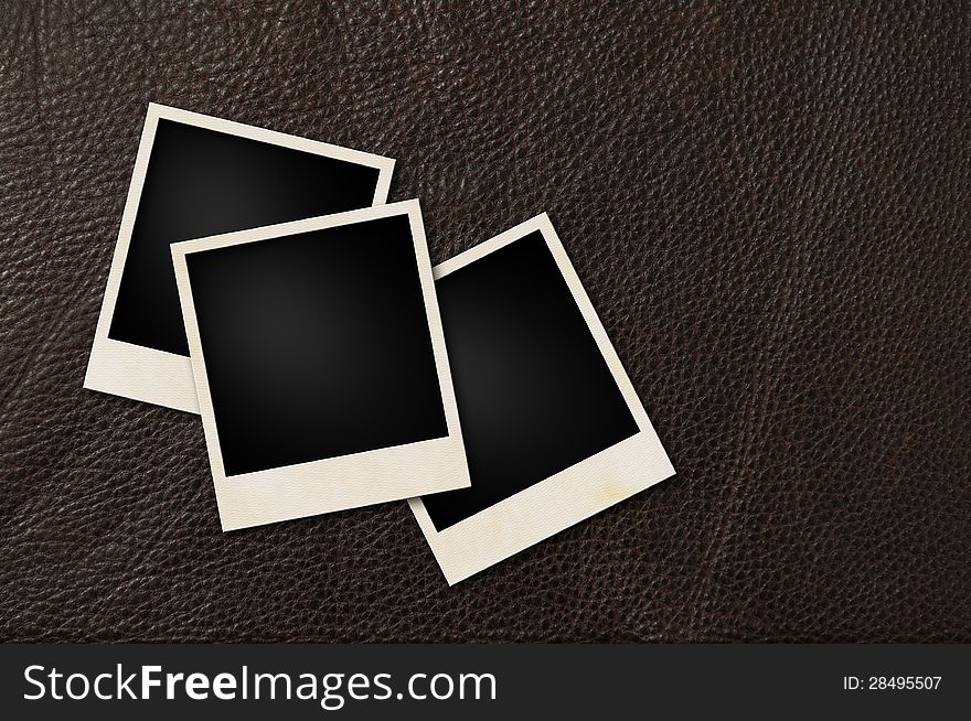 Instant films on brown leather background. Instant films on brown leather background