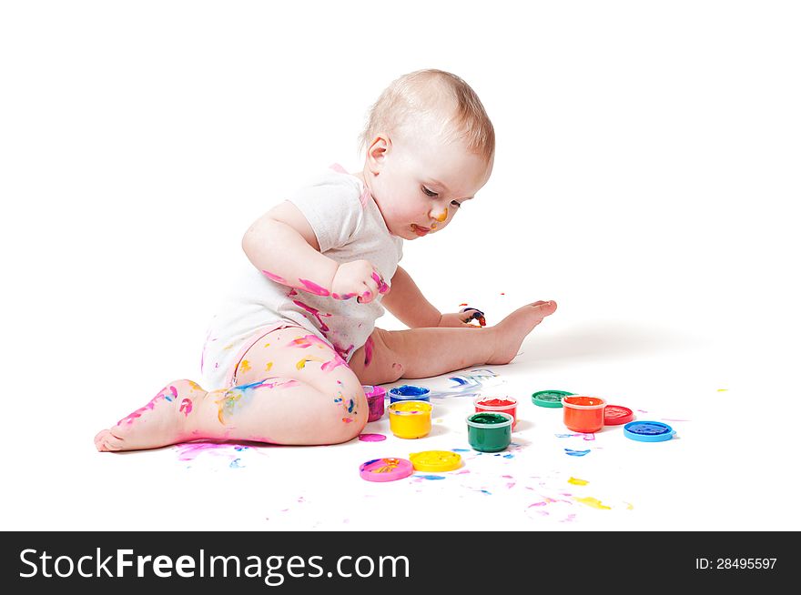 Year-old child playing with paints. Year-old child playing with paints