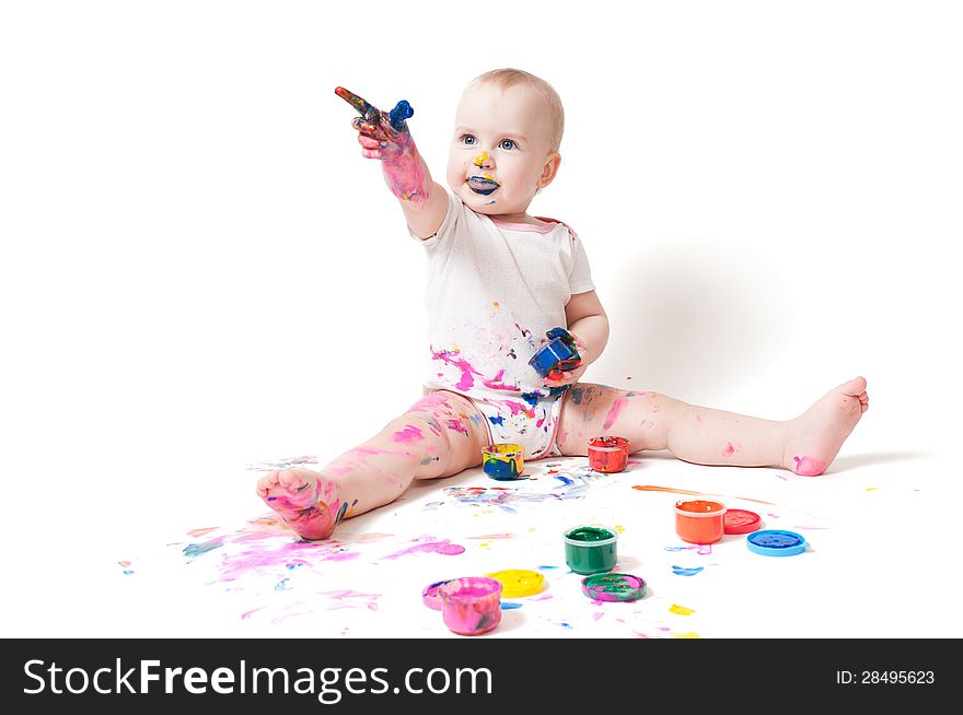 Year-old child playing with paints. Year-old child playing with paints