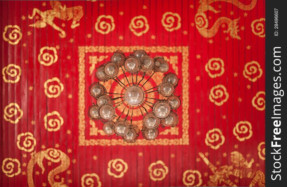 Old vintage lantern in the red background. Old vintage lantern in the red background