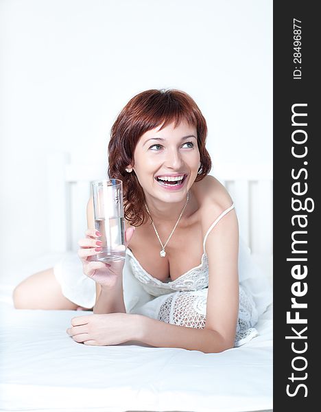 Healthy Young Woman with glass of fresh Water
