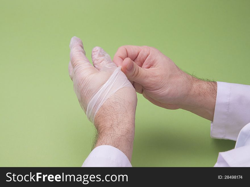 Doctor Taking Off Latex Surgical Gloves