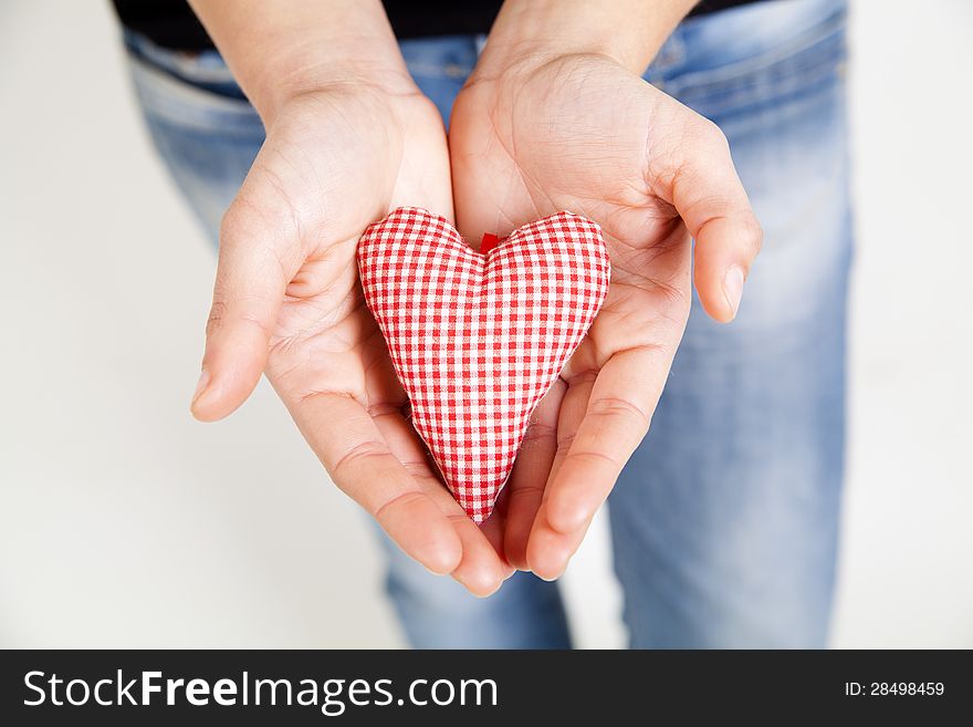 Woman hands holding a heart. Healtcare