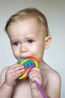 Toddler With Lollipop Stock Photos