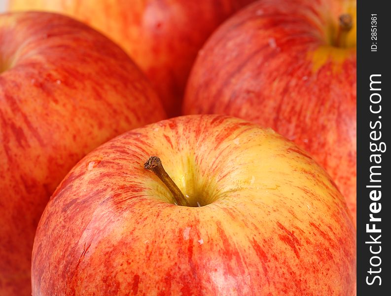 A closeup of four ripe Gala apples. A closeup of four ripe Gala apples