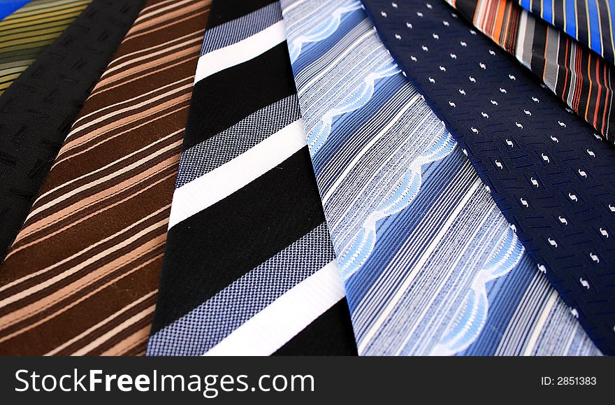 Lots of ties isolated over white.