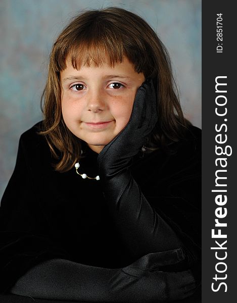 Young lady in black velvet wrap with black gloves. Young lady in black velvet wrap with black gloves