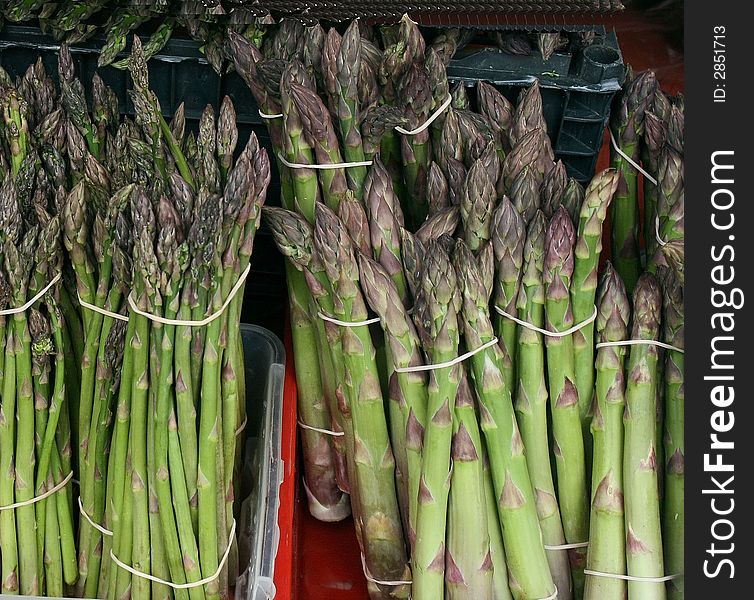Close up of stocks of asparagus displayed at a farmer's market. Close up of stocks of asparagus displayed at a farmer's market
