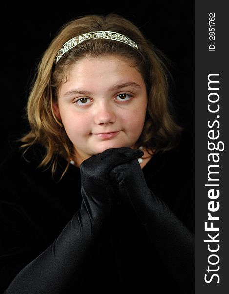 Young lady in a black drape with black gloves