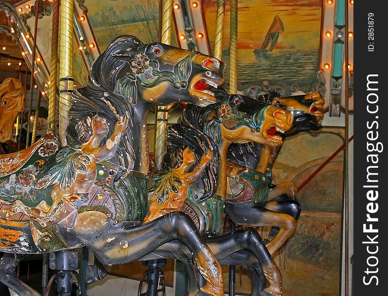 Close up of three carousel horses