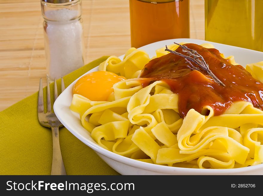 Italian food pasta with tomato sauce on white bowl. Italian food pasta with tomato sauce on white bowl