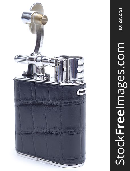 Black old time fashioned cigarette lighter isolated over white background. Black old time fashioned cigarette lighter isolated over white background