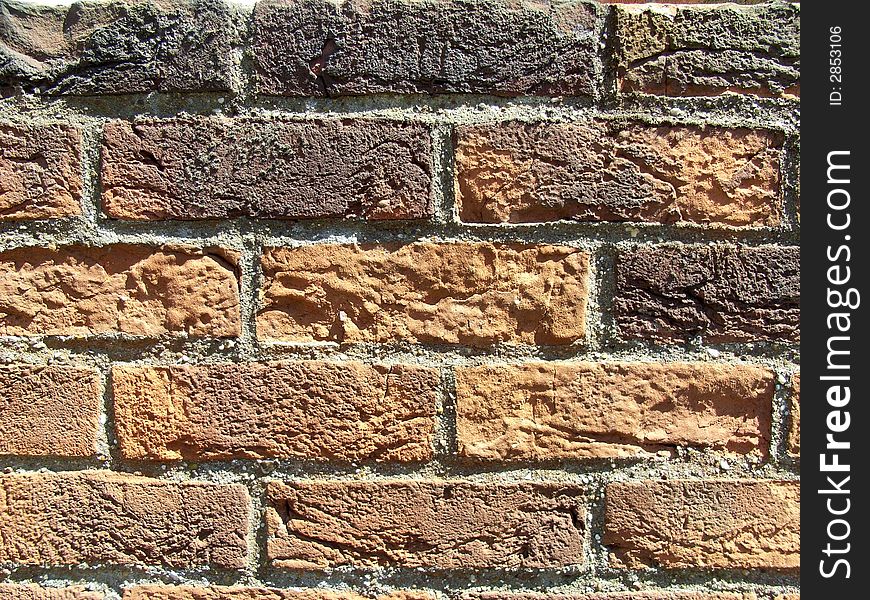 A close up photograph of a brick wall. A close up photograph of a brick wall.