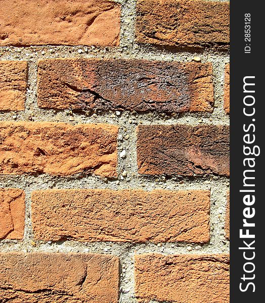 A close up photograph of a brick wall. A close up photograph of a brick wall.