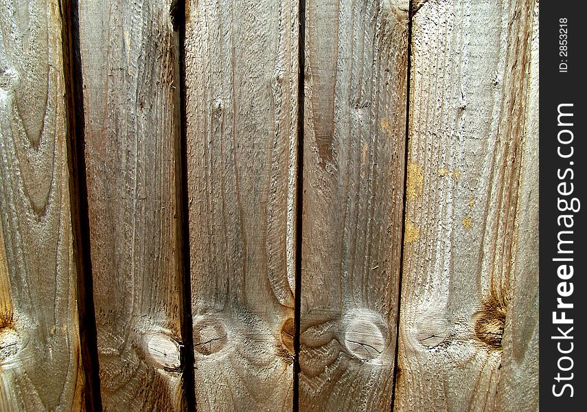 A close up image of a wooden fence. A close up image of a wooden fence.