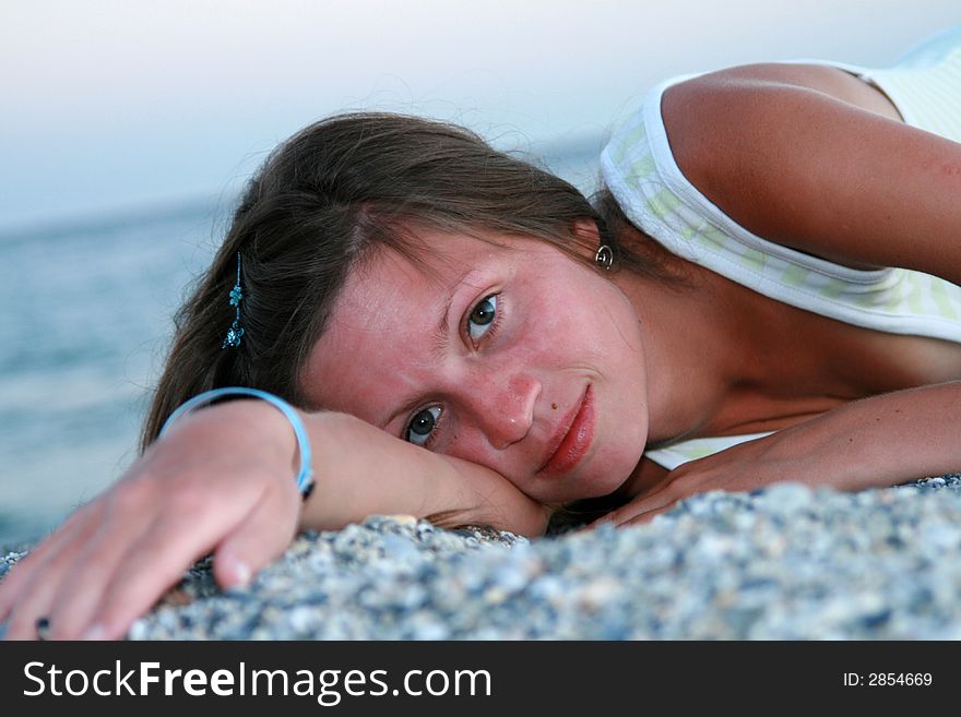 Young woman lying on beach