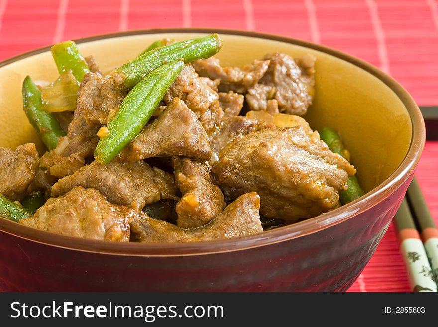 Asian food of beef and vegetables on brown bowl. Asian food of beef and vegetables on brown bowl