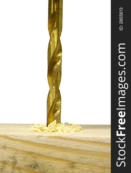 Closeup of drilling into piece of wood with golden drill. Closeup of drilling into piece of wood with golden drill.