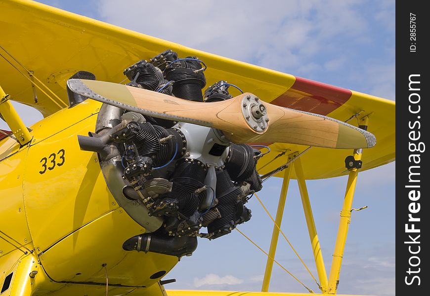 Yellow oldtime airplane with a wooden Propeller. Yellow oldtime airplane with a wooden Propeller