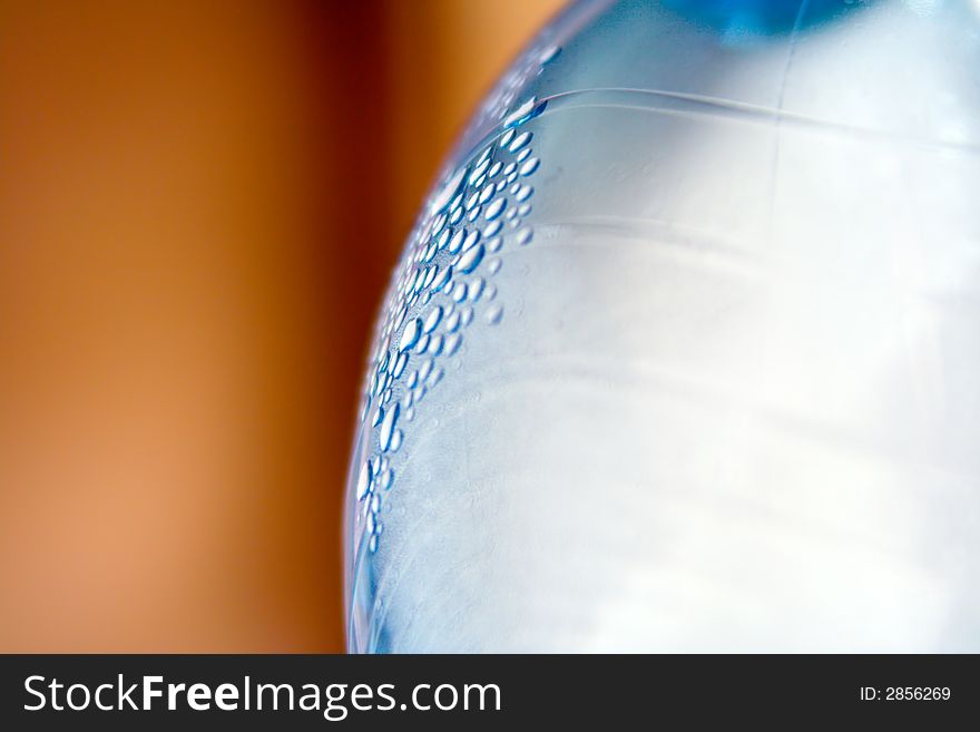 Close-up of bottle with water droplets.