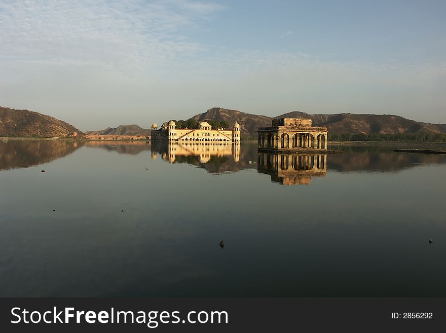 Reflections of palaces in a lake in Jaipur