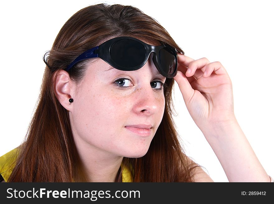 Attractive teen girl lifting sunglasses looking at camera and smiling. Attractive teen girl lifting sunglasses looking at camera and smiling