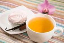 Cup Of Tea And Pink Marshmallow On A Saucer With A Vanilla Royalty Free Stock Photos